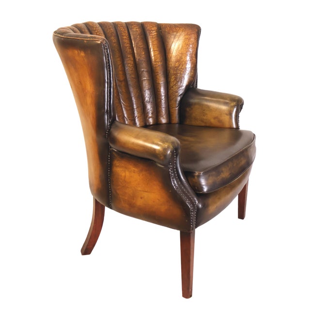 Art Deco Leather Channel-Back Club Chair, English, Circa 1940. A striking Art Deco channel back club chair upholstered in...
