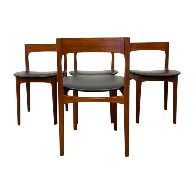 This vintage set of four mid-century modern dining side chairs embodies classic Danish modern design, featuring sculpted,...