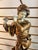 Vintage lamp of a Golden figure of someone playing the flute. The base has a markings from Sculpturite Creations Company...