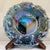 This dazzling iridescent pressed glass console bowl features a bold raised starburst flower center framed by a tight...