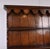 A handsome english country house oak dresser with integral plate rack above by renowned makers titmarsh & goodwin,...