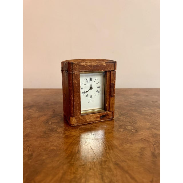 Antique Victorian quality brass carriage clock with the original leather travelling case, having a quality brass carriage...