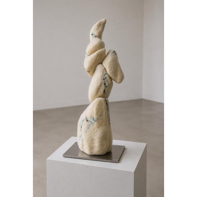 L'empilement Des Grâces Sculpture in Felted Wool & Metal by Tina Tictone. Dimensions: W 27 x D 30 x H 96 cm. Materials:...