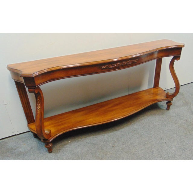 French style console table, made of cherry, scalloped top and sides, scrolled column supports with carved details, turned...