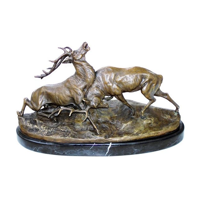 This solid bronze sculpture portrays a dramatic fight between two stags, a scene of raw wilderness crafted using the lost-...