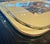 Elegant vintage Italian serving tray featuring a cream-colored surface with a detailed pastoral villa scene at the center....