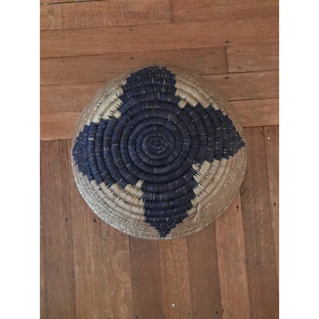 Beautiful round hand-made African woven basket blue and brown. Decorative and functional. Good condition. Acquired at an...