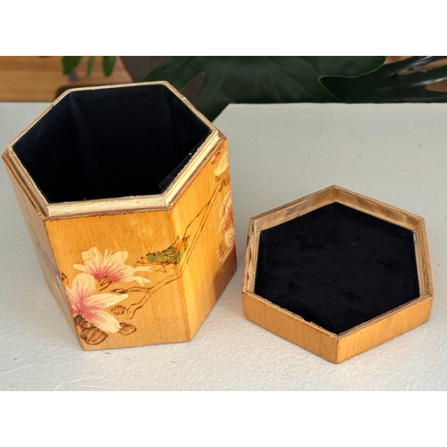 Delightful Chinese accent box, painted with cherry blossoms and a grasshopper. Interior is lined with black fabric. Most...