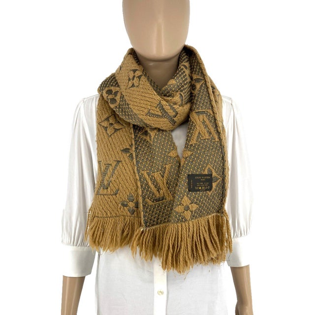 Louis Vuitton Thick Wool & Silk Blend Brown Scarf. Logomania-style monogram knit in camel brown with grey LV motifs and...