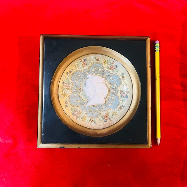 DESIGN: The plaque showcases a 3D relief portrait cameo of a lady in profile, surrounded by a gold and blue floral and...