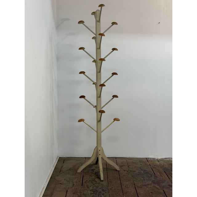 The stand holds twenty garments or hats. Wonderful store display for the vintage clothing dealer. Pine construction. Dowel...