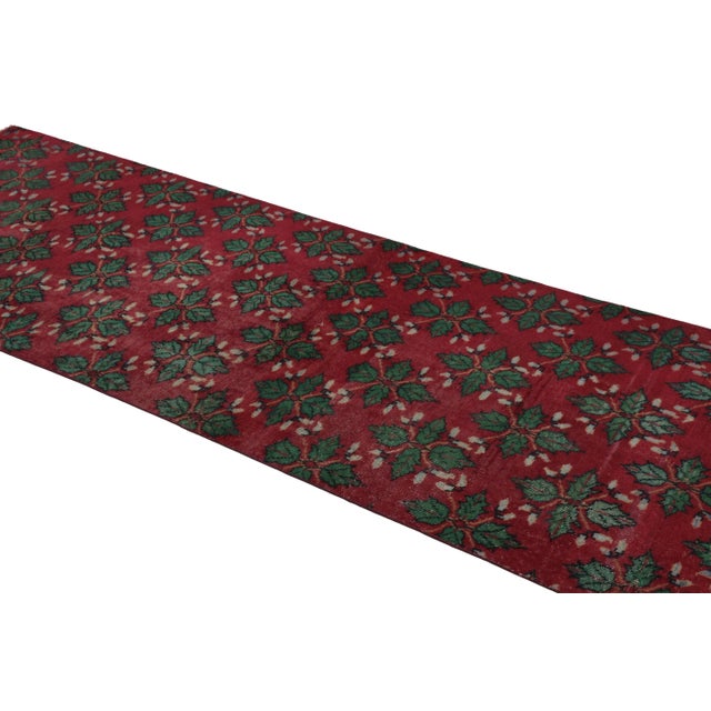 This vintage runner rug is a 3x9 Turkish distressed piece, made with hand-knotted wool circa mid-20th century. It is an...