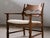 Henning Kjærnulf's lounge chair, known as the "Razorblade," epitomizes Danish Modern design from the 1960s. Crafted from...