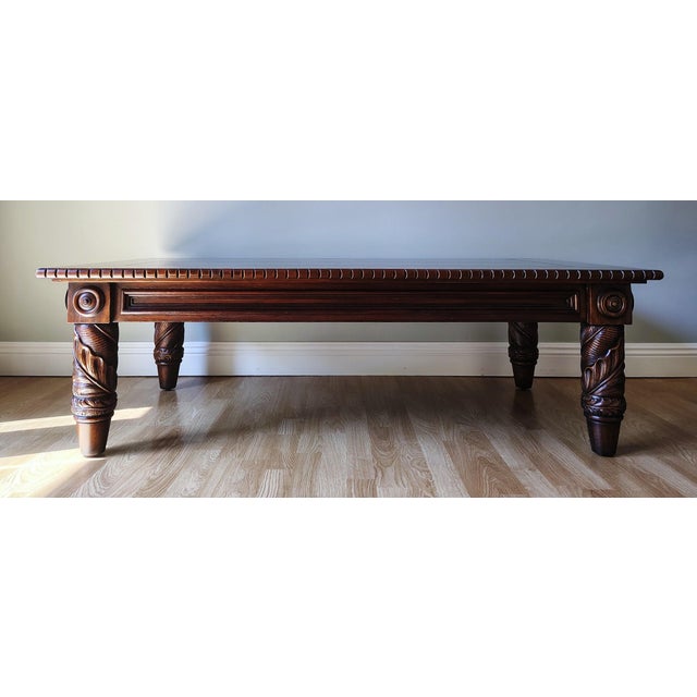 This is a beautiful carved Ralph Lauren Polo Safari coffee table in the Dutton collection. It is made of mahogany with...