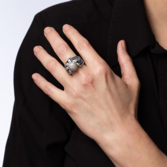 Stylish diamond & sapphire Octopus ring crafted in 18 karat white gold. Pave set diamonds total an estimated 1 carat...