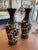 This is a pair of beautifully hand painted vases depicting flowers and vines. These have a soft cream background with...