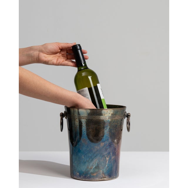 This mid 20th century ice bucket from France is finished in teal, worked in silver. Its form follows honest, well-...