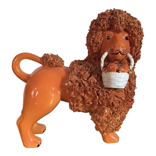 Antique Pottery Poodle Holding a Basket of Fruit with Orange Glaze Figure For Sale