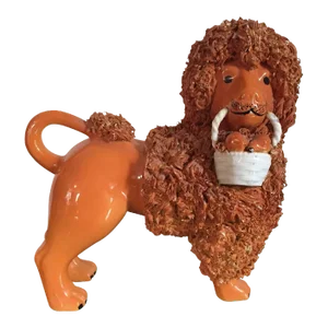 Antique Pottery Poodle Holding a Basket of Fruit with Orange Glaze Figure