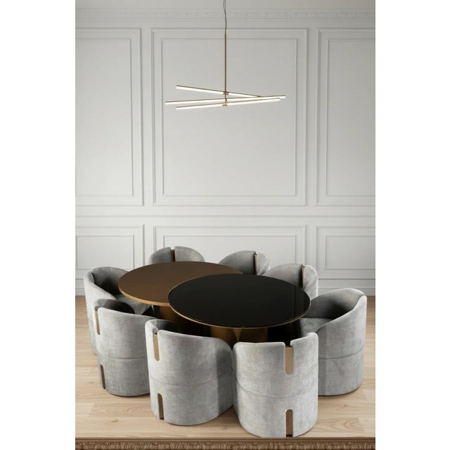 This set comes with a luxury irregular shape dining table with 8 gray chenille velvet upholstered armchair dining chairs....