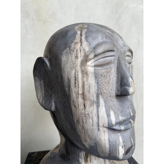 A quiet presence with ancient origins. This contemporary bust sculpture is hand-carved from petrified wood — a material...