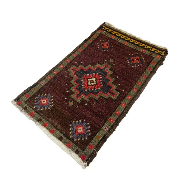 Vintage Handknotted decorative mini rug from Kars region of Turkey. Approximately 45-55 years old. In very good condition.
