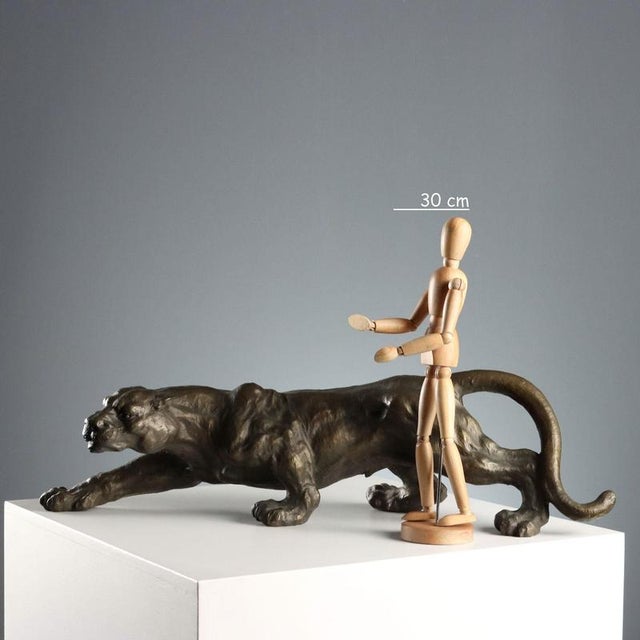 Bronze sculpture depicting a panther. This piece is attributed to the mentioned designer/maker. It has no attribution mark...
