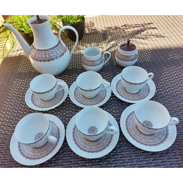Vintage Bidasoa porcelain coffee set from 1969. It comprises six coffee cups with saucers, a coffee pot, a creamer, and a...