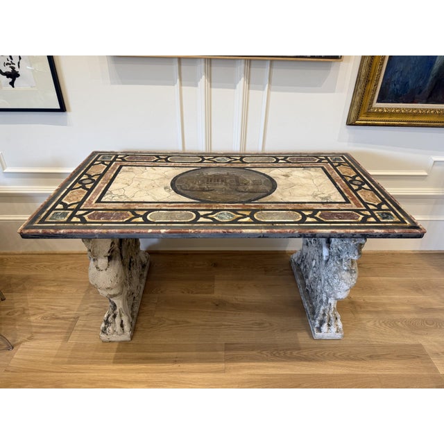 A stunning example of Italian craftsmanship, this Pietra Dura marble inlay table features intricate floral stonework set...