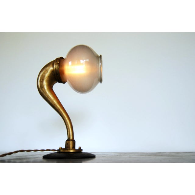 A marriage between a gramophone stem and an old medical glass from Paris. Stands 34cm tall. E27 base socket.