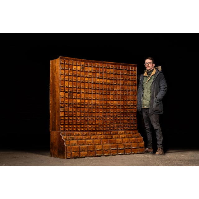 Monumental industrial hardware cabinet constructed from solid hardwood, fitted with an extraordinary array of 370 drawers...