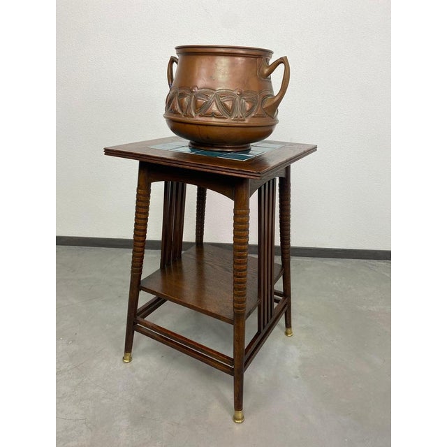 Jugendstil side table with blue tiles top and brass leg endings designed by Adolf Loos in very good original condition....