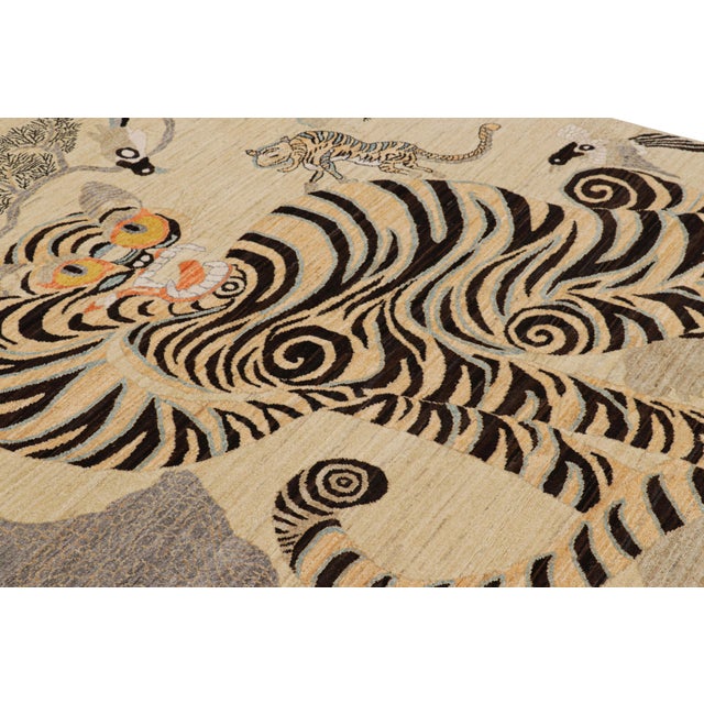 Hand-knotted in wool, this 6x8 modern tiger pictorial rug is a bold addition to the Rug & Kilim exclusive Tiger line. On...