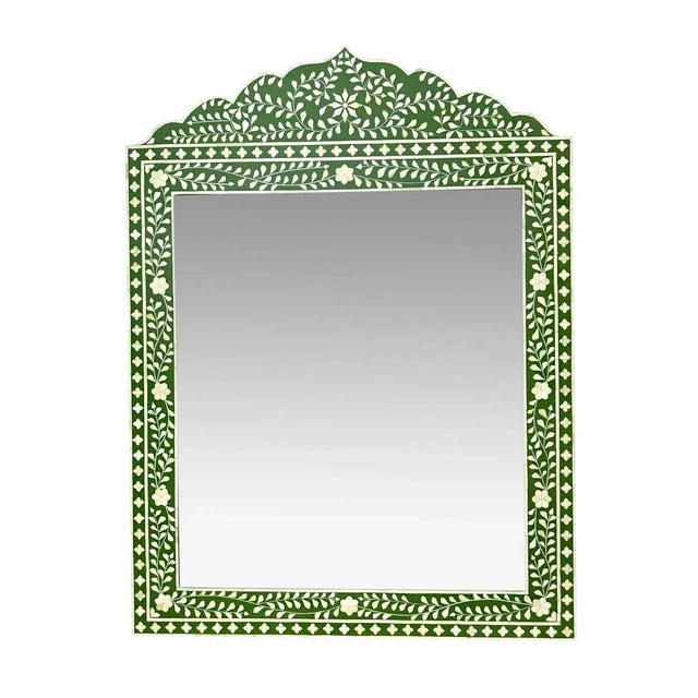 This handmade Marrakech bone inlay mirror frame features a striking floral pattern, crafted by skilled artisans in India....