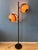 Brown mid century floor lamp by Herda with metal base and acrylic glass mushroom shades. The acrylic glass shades can be...