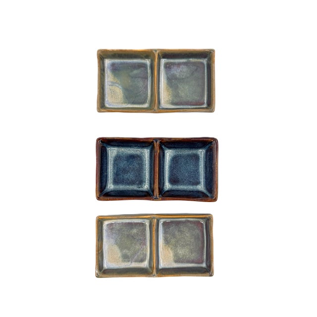 A curated set of three authentic handmade ceramic double dishes from Bat Trang, Vietnam, a village internationally...