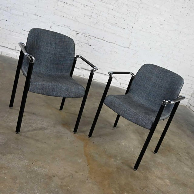Striking pair of vintage modern Herman Miller chrome & black armchairs wearing their original gray iridescent fabric....