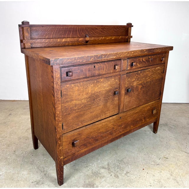 A classic quarter-sawn oak buffet by Standard Table Company of Jamestown New York circa 1920’s. Features two locking top...
