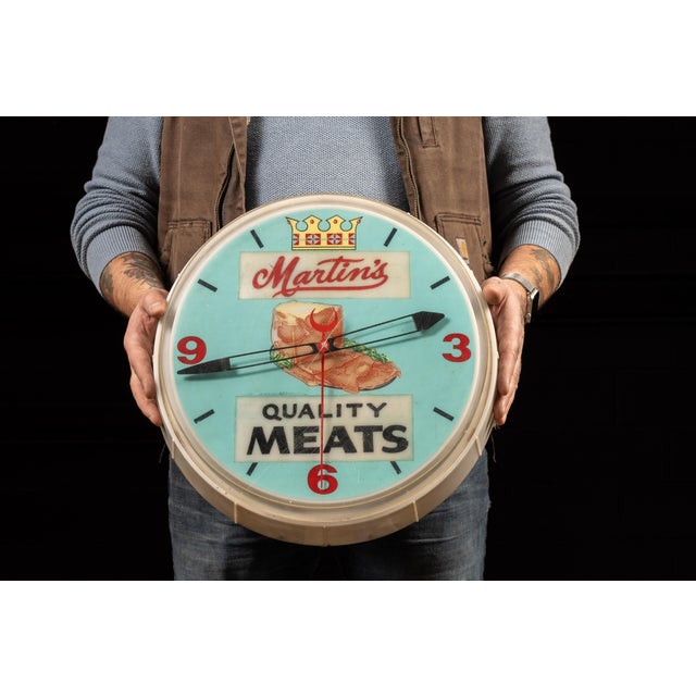 c. 1960s; mfd. by Neon Products Inc. for Martin's Quality Meats - Philadelphia, PA Vintage lighted advertising clock. This...