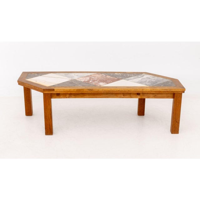 Modern Asymmetrical Marble Top Coffee Table, with inset marble tiles and oak wood frame. 16.5" H x 56.75" W x 22" D....