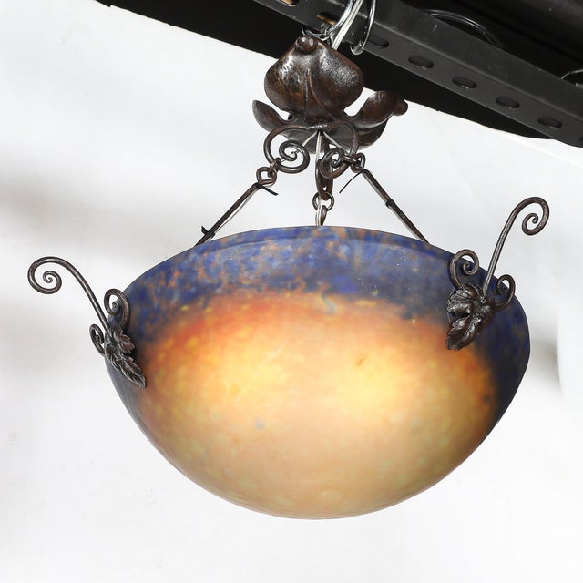 This exquisite Art Deco pâte de verre glass pendant chandelier, signed Muller Frères and created in France circa 1930, is...