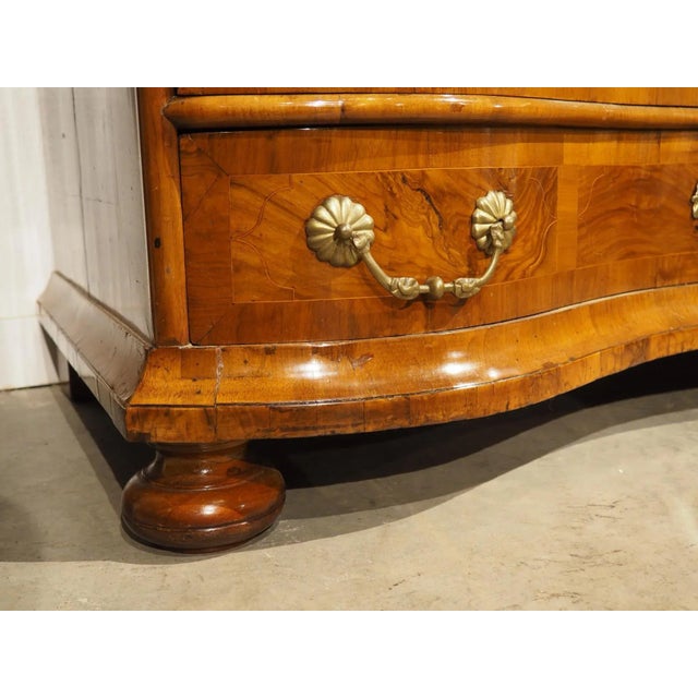 Truly the work of a master-level woodworker from Southern Germany, this four-drawer commode has a unique serpentine shape....