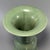 This vintage‑style celadon vase features a graceful flared opening, bulged middle section and glossy smooth green glaze....