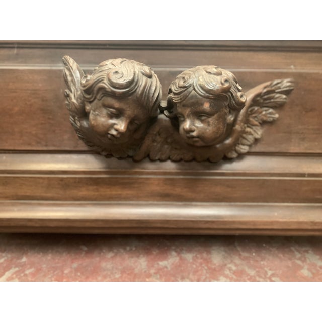 Napoleon iii style planter in solid oak the front is decorated with two putti heads good condition zinc liner missing...
