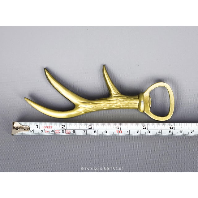 Vintage Gold Metal Deer Antler Bottle Opener This bottle opener is made from metal and features deer antler design. Great...