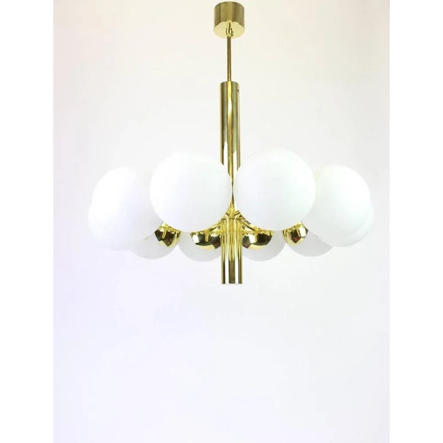 Stunning radial sputnik brass chandelier with six opal glass globes by kaiser leuchten, germany, 1960s. High quality and...