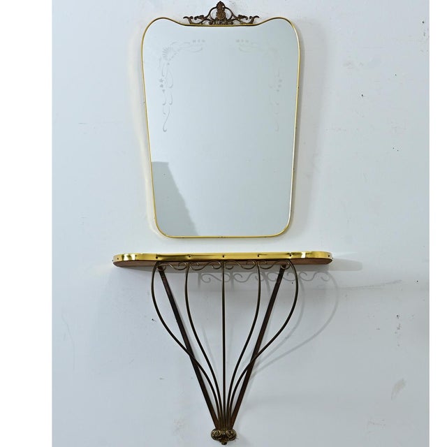 This mid-century French mirror and console set is the perfect pair to add a bit of Hollywood glamor to your space. The...