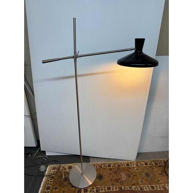 Design Plus Gallery presents a Cantilever Floor Lamp with Black Adjusting Light Source. The lamp has a design that is...