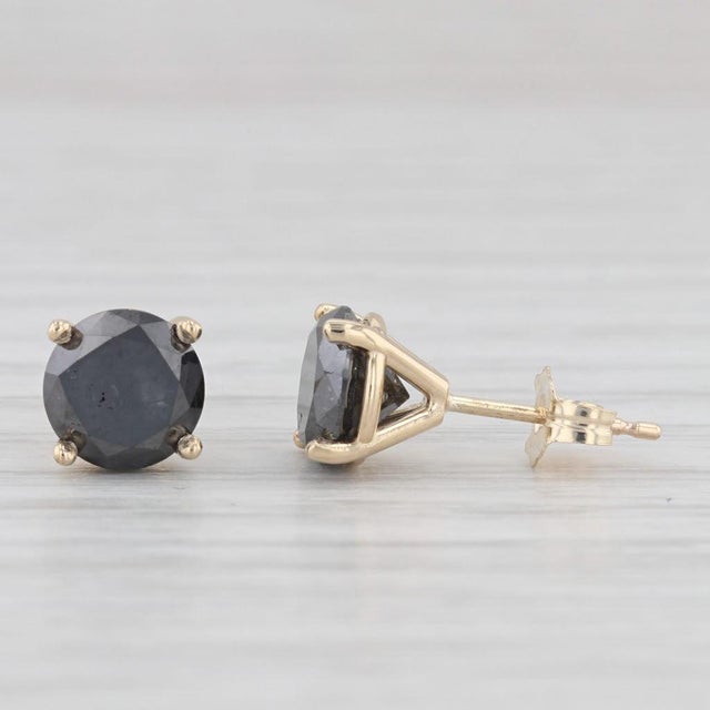 Gemstone Information: - Natural Diamonds - Total Carats - 2.67ctw Cut - Round Brilliant Color - Black Metal: 14k Yellow...