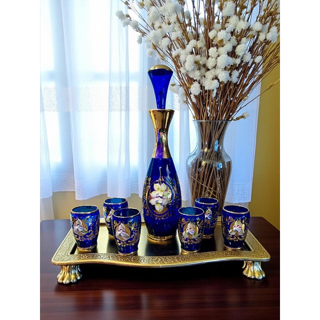 Brilliant cobalt glass liqueur set comprising decanter (11.5" x 3") with stopper and six cordials (each 2.75" x 1.75")....